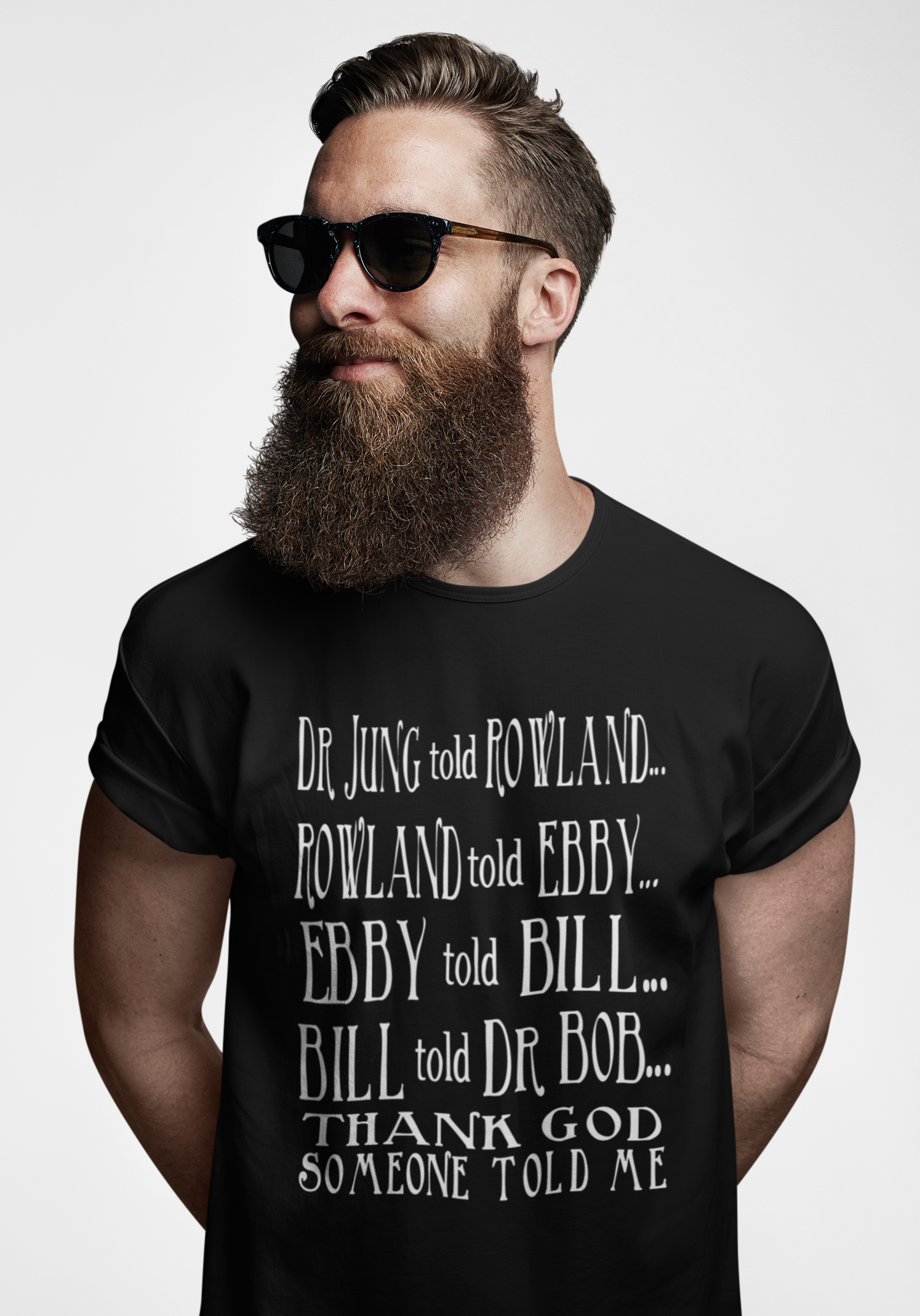 Man wearing a black t-shirt with text on a white background