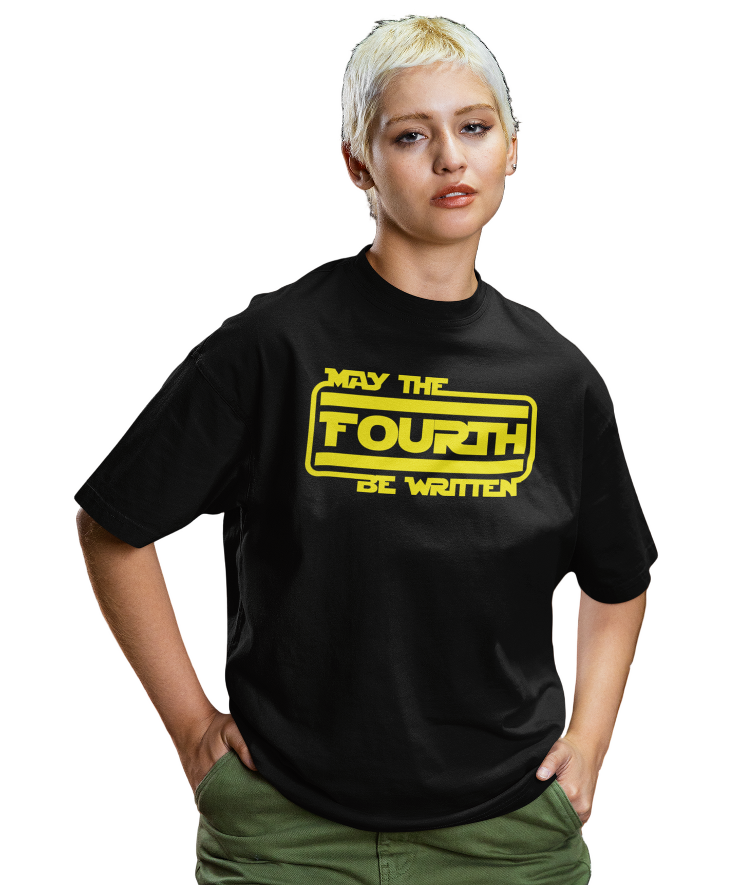 Person wearing a black t-shirt with yellow text standing in front of a car.